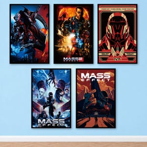 May include: Five rectangular wall posters featuring Mass Effect video game artwork. The collection includes character collages, a red N7 recruitment graphic with the text 'STAND FAST STAND STRONG STAND TOGETHER ENLIST TODAY', and stylised landscape scenes.
