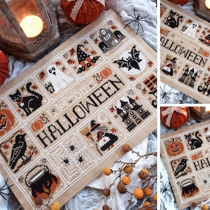 May include: A rectangular cross-stitch sampler on tan fabric featuring the text "Welcome HALLOWEEN" surrounded by grid-patterned squares containing motifs of a black cat, ghost, witch, bat, haunted house, raven, cauldron, and spiders.