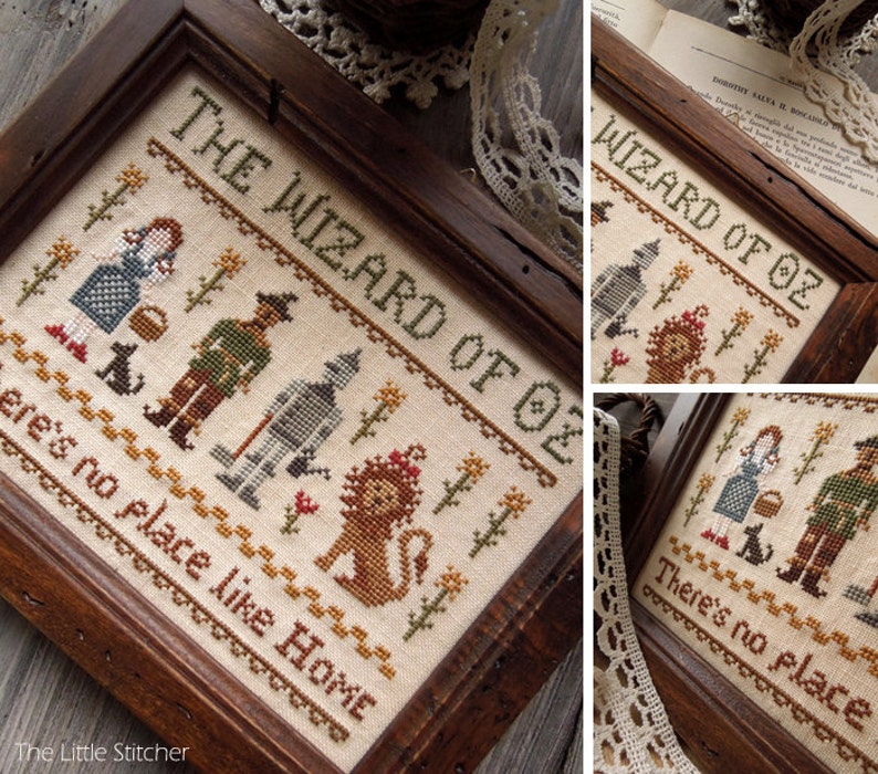 Peut inclure: Une broderie au point de croix encadr&eacute;e repr&eacute;sentant des personnages du Magicien d'Oz, dont Dorothy, l'&Eacute;pouvantail, l'Homme de Fer-Blanc et le Lion peureux. La broderie comprend le texte "The Wizard of Oz" et "There's no place like home."