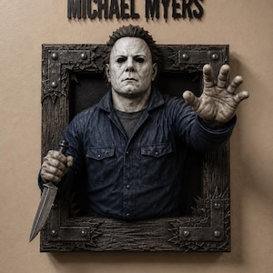 May include: A three-dimensional wall sculpture of Michael Myers emerging from a dark, wood-textured frame with metal corner accents. The figure wears a dark blue jumpsuit, holds a silver knife, and has one hand extended forward. The text MICHAEL MYERS is displayed above.