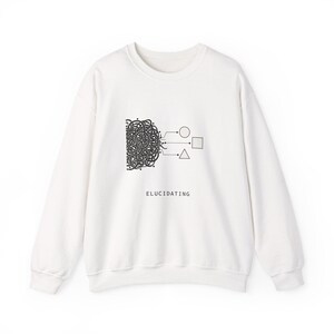 May include: A white long-sleeve sweatshirt featuring a black graphic print on the chest. The design displays a complex tangle of lines connecting to a circle, a square, and a triangle, with the word ELUCIDATING printed in black below the graphic.