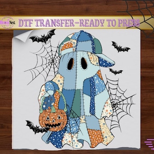 May include: A DTF transfer sheet featuring a patchwork ghost wearing a baseball cap and holding a jack-o'-lantern. The ghost is surrounded by black spiderwebs and bats. The text at the top reads DTF TRANSFER-READY TO PRESS.