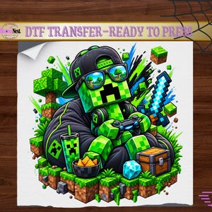 May include: A DTF transfer sheet featuring a green pixelated character wearing a black cap and sunglasses, holding a game controller. The character sits on a blocky landscape with a blue sword, a treasure chest, a drink, and snacks.