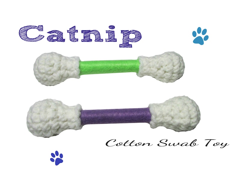May include: Two crocheted catnip toys, one with a green stick and one with a purple stick. The toys are shaped like cotton swabs. The text "Catnip" and "Cotton Swab Toy" are written on the image.