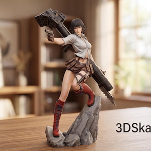 May include: A collectible figurine of a character with short dark hair, wearing a light-colored button-down shirt, a brown pleated skirt, and red lace-up boots. The figure holds a handgun and a large black rocket launcher, standing on a gray rock base.