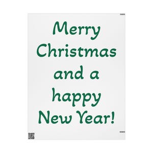 May include: A white rectangular sign featuring the dark green text Merry Christmas and a happy New Year! in a rounded font. The design includes a small QR code in the bottom left corner and a tiny barcode symbol in the top and bottom right corners.