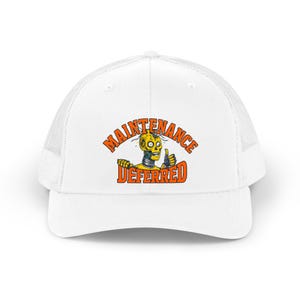 May include: A white trucker hat featuring a graphic of a yellow robot head with a thumbs-up gesture. The text "MAINTENANCE DEFERRED" is printed in orange block letters above and below the robot illustration on the front panel.