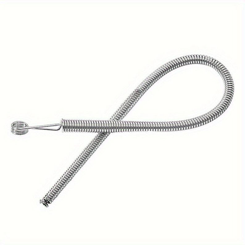 May include: A flexible silver-colored metal spring tool featuring a long, coiled wire body that loops back on itself. One end terminates in a small, tightly wound circular coil, while the other end remains open, showcasing the uniform metallic texture.