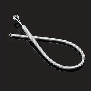 May include: A flexible silver-colored metal spring tool with a tightly coiled body and a small circular loop at one end. The tool is bent into a curved shape, showcasing its metallic texture and uniform coil pattern throughout its entire length.