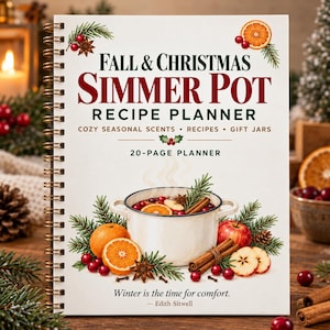 Pode incluir: Um planejador de receitas de 20 páginas com encadernação em espiral e capa branca. A capa apresenta ilustrações de laranjas, cranberries, paus de canela e ramos de pinheiro ao redor de uma panela branca, com o texto "Winter is the time for comfort."