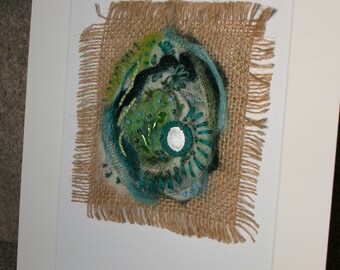 Green felted seed pod