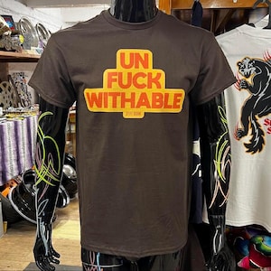 Unfuckwithable brown t-shirt by STIFF SKUNK crew neck lettering typography sign funny illustration graphic design Gildan unisex tee
