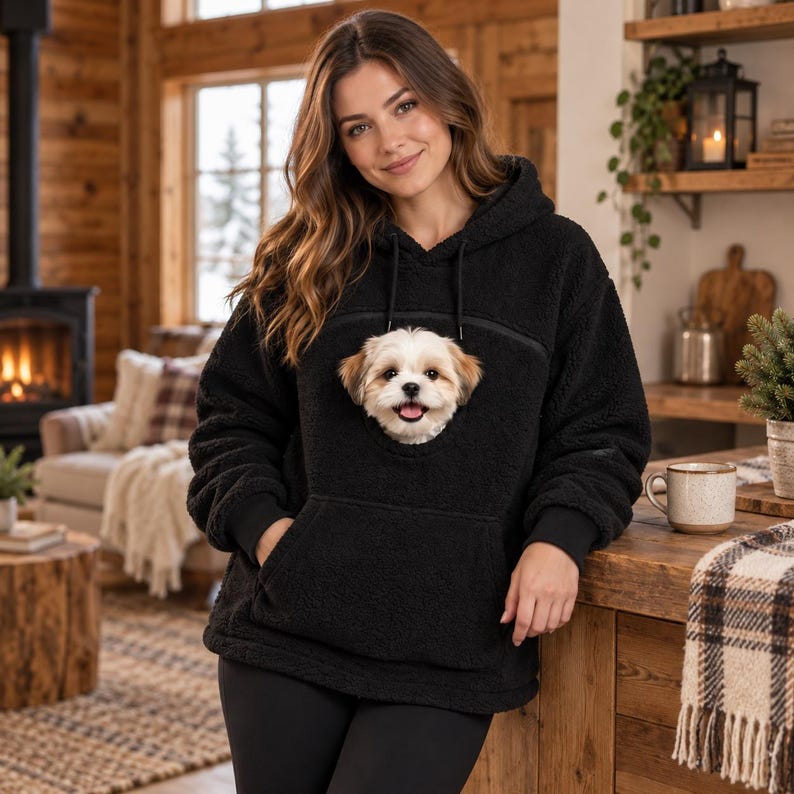 Black PawHug polar fleece hoodie with small dog in pouch