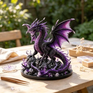 May include: A detailed dragon figurine crafted from numerous small purple and black beads. The dragon features large, textured wings, a sharp-toothed open mouth, and a long tail, all perched atop a dark, rocky base accented with purple crystals.
