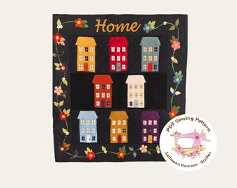 May include: A PDF sewing pattern for a quilt featuring a black background with a floral vine border and a grid of colourful houses. The title of the pattern is "Home" and the designer is "Sallieann Harrison - Quilter".