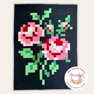 May include: A black quilt with a pixelated floral design of pink and red roses and green leaves. The quilt has a stitched border and a circular logo in the bottom right corner that reads "PDF Sewing Pattern" and "Sallieann Harrison - Quilter."