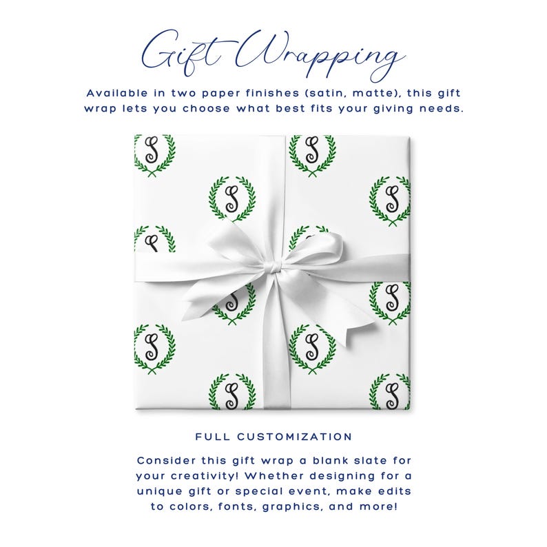 May include: White gift wrap with a repeating pattern of green laurel wreaths and the letter "S" in black. A white satin ribbon is tied around the wrapped gift. The text "Gift Wrapping" is at the top.