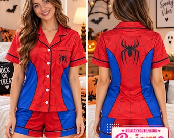 May include: A red and blue short-sleeve pajama set featuring a black spider web pattern and a black spider graphic on the chest and back. The top has a collared neckline with white buttons and black piping along the edges of the shirt and shorts.