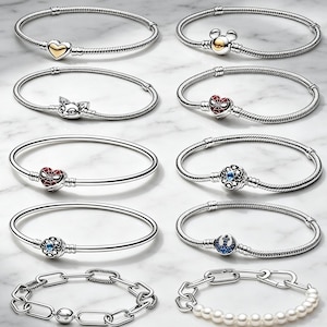 Puede incluir: Diez pulseras de cadena de serpiente y eslabones plateados dispuestas en filas. Los dijes incluyen un corazón dorado, cabeza de Mickey Mouse, cara de gato, corazón de Spider-Man, esfera con estrellas, esfera con gema azul y símbolo rebelde.