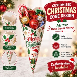 Puede incluir: Un cono de papel en forma de corazón lleno de dulces variados, incluyendo un bastón de caramelo, un chocolate envuelto en dorado, una trufa Lindor roja y un chocolate con forma de muñeco de nieve. El cono tiene un estampado de Merry Christmas.