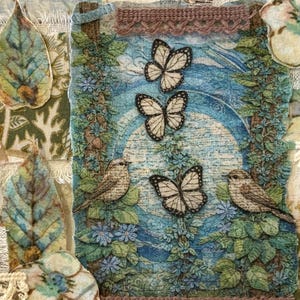 May include: A mixed media artwork featuring butterflies, birds, and floral elements. The piece incorporates fabric scraps with leaf and flower appliqués. The color palette includes blues, greens, and browns, creating a vintage, nature-inspired aesthetic.
