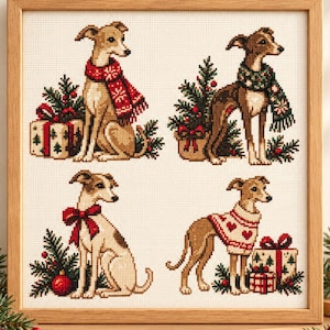 May include: A framed cross-stitch embroidery featuring four tan greyhound-type dogs in holiday settings. The dogs wear red and white scarves or sweaters, surrounded by pine branches, red ornaments, and wrapped gift boxes with bows.