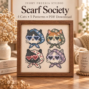 May include: A square wooden frame containing a cross-stitch embroidery of four cats wearing scarves and heart-shaped sunglasses. The text above reads Ivory Freesia Studio, Scarf Society, 4 Cats, 5 Patterns, PDF Download. The cats are black, orange, and purple.