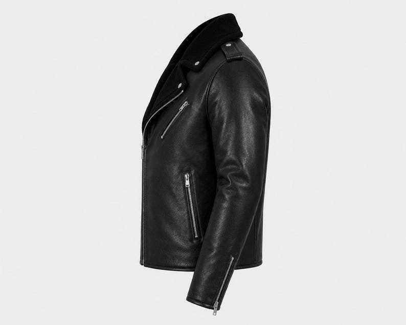May include: A black leather motorcycle jacket featuring a wide collar, silver-toned metal zippers on the front, side pockets, and cuffs. The jacket has a structured silhouette with epaulets on the shoulders and a smooth, matte-textured finish.