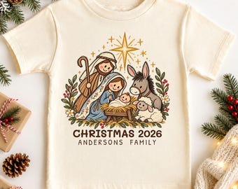 Magliette natalizie personalizzate per famiglie cristiane 2026, maglietta natalizia coordinata con scena della Natività per la famiglia, maglietta di gruppo natalizia personalizzata con cognome per cugini
