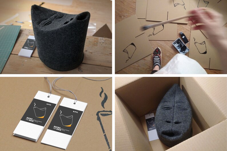 May include: A dark gray felt mask with a stylized face, displayed in various stages of creation. The mask is shown on a wooden surface, in a cardboard box, and with tags. The tags read "Maska the Mask" and "Kaczka the Duck".