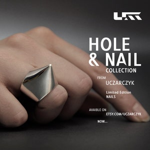 May include: A silver ring with a pointed, geometric design. The ring is part of the "Hole & Nail Collection" from UCZARCZYK, a limited edition of nails. The ring is available on Etsy.com/uczarczyk.