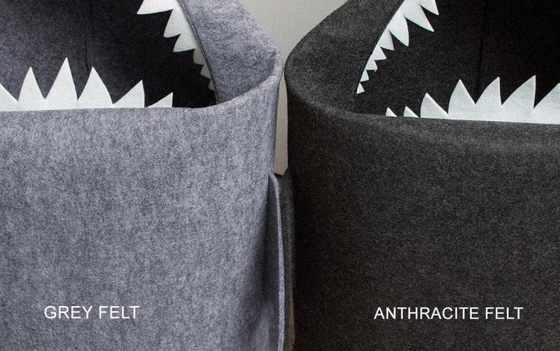 May include: Two felt storage bins, one grey and one dark grey, each with a shark-mouth design. The shark's mouth is created with white, jagged felt teeth. The grey bin is labeled "GREY FELT" and the dark grey bin is labeled "ANTHRACITE FELT".