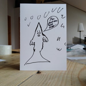 May include: A white greeting card with a hand-drawn cartoon figure in a pointed hood. The figure has a surprised expression and a speech bubble that says, "I'm just an old tree..." Black ink drawings of rain and other shapes surround the figure.