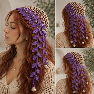 May include: A beige crochet hair net featuring a decorative purple vine pattern with detailed leaves and small white flower accents at the ends of the hanging strands. The accessory is designed to cover the crown of the head with a mesh structure.