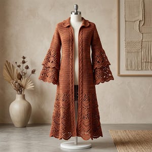 May include: A long, rust-colored crochet cardigan featuring a collared neckline, long sleeves with tiered, flared lace-patterned cuffs, and a matching lace-patterned hem. The front placket is detailed with vertical cable-knit style crochet textures.