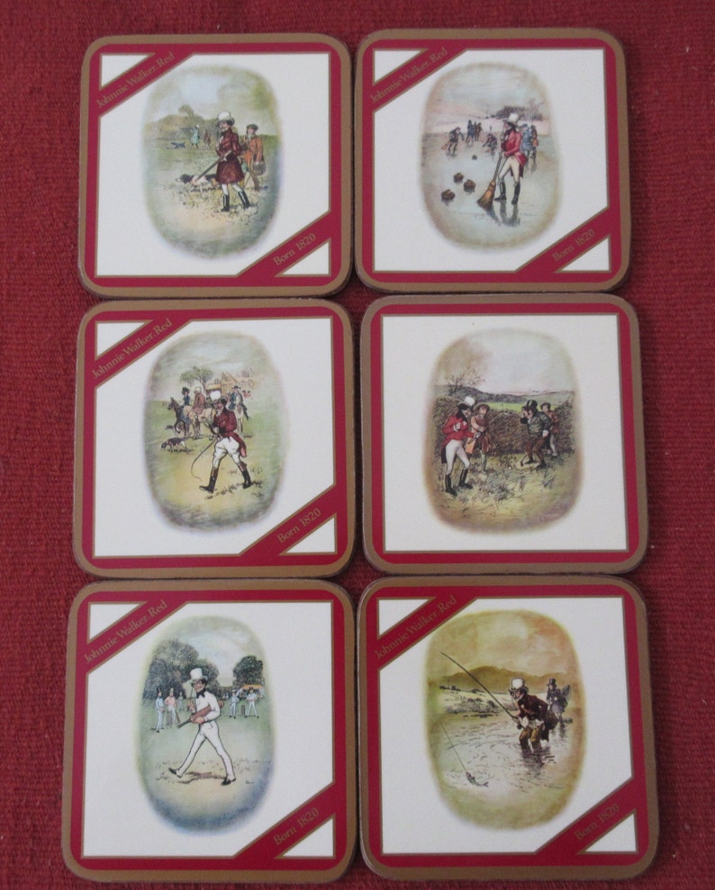May include: Six square coasters with gold trim and red borders. Each coaster features a different illustration of a man in a historical setting. The illustrations are in a vintage style and include scenes of a man playing golf, a man ice skating, a man riding a horse, a man playing cricket, a man fishing, and a man hunting. Each coaster has the text "Johnnie Walker Red" and "Born 1820" printed on it.
