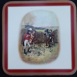 May include: A vintage-style coaster featuring a colorful illustration of four men playing golf in a field. The men are dressed in traditional clothing, and the scene is set against a backdrop of rolling hills.