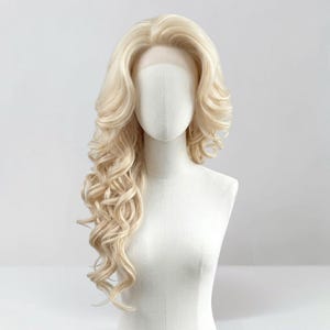 May include: A long, platinum blonde wig with voluminous, loose curls cascading down one side. The hair features a side-parted style with soft, layered waves that frame the face, displayed on a neutral-toned mannequin head and torso.