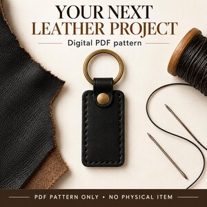 Black rectangular leather keychain beside an open ivory gift box and gold ribbon, with “Craft a Little Gift” and PDF pattern text.