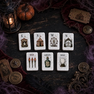 May include: Seven rectangular white tiles featuring illustrations of a ticket booth with a ghost, a circus tent, a ferris wheel, an ornate gate, three torches labeled RED, a bottle labeled GREEN POISON CANDY, and a crystal ball labeled SOAP.