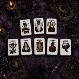 May include: Eight rectangular playing cards labeled JOKER, each featuring a unique illustration: a skeleton drummer, a ghost with a wand, a muscular vampire, a harlequin on a swing, a fortune teller, a mummy, a wolf in a suit, and a bat.
