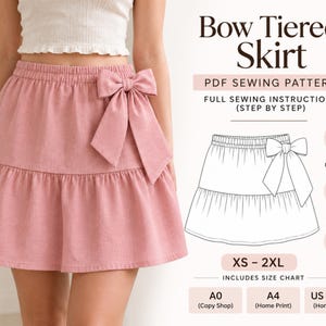 May include: A dusty pink tiered skirt with an elastic waistband and a large side bow. The image includes text reading Bow Tiered Skirt, PDF Sewing Pattern, Full Sewing Instructions, and size range XS-2XL with A0, A4, and US print options.