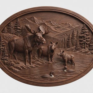 May include: An oval-shaped dark brown wooden wall plaque featuring a detailed relief carving of a moose family standing near a lake. The scene includes a mountain range, pine trees, and two swimming loons in the water, all rendered in wood.