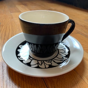 It’s a Daisy midcentury modern Royal China cup and saucer set