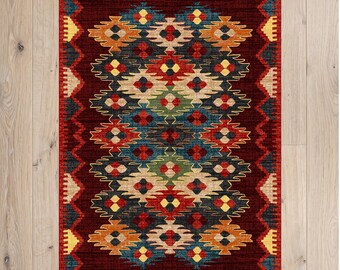 May include: A rectangular area rug featuring a deep red background with a repeating geometric pattern in shades of orange, yellow, blue, green, and cream. The border consists of a jagged, zigzag design in yellow and dark red.