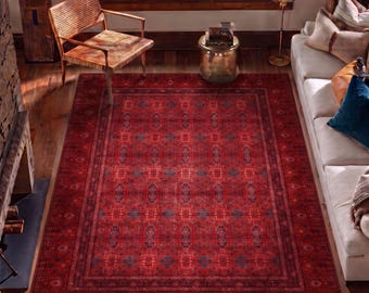 May include: A large rectangular area rug featuring a deep red base color with intricate, repeating geometric and floral patterns in dark blue and black tones, finished with a wide, detailed border that frames the central design.