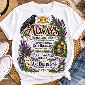 May include: A white t-shirt featuring a graphic print of a black crow, a moon phase symbol, and purple lavender sprigs. The text reads: Always throw spilled salt over your left shoulder. Keep rosemary by your garden gate. Plant lavender for luck.