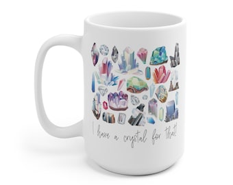May include: White ceramic mug with a colorful illustration of various crystals and the text "I have a crystal for that!"