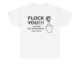 May include: A white t-shirt featuring a black graphic of a hand giving the middle finger with a solar-powered security camera on the fingertip. The text reads: FLOCK YOU!!! ...and the 4th Amendment. - City Council, printed in black block lettering.