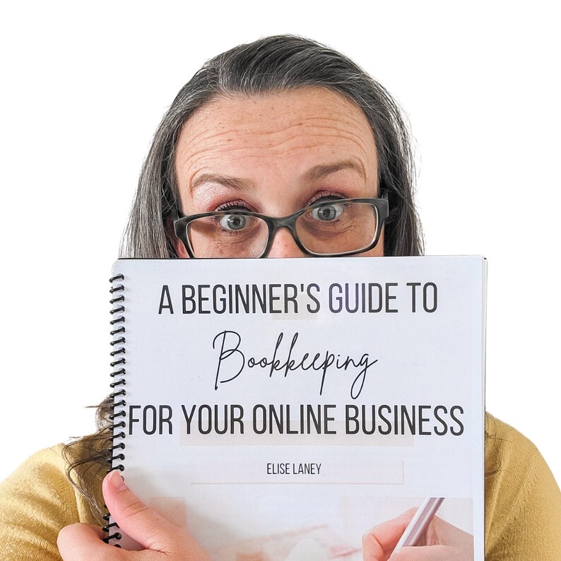 May include: A white book with a black spiral binding. The cover has the text "A Beginner's Guide to Bookkeeping for Your Online Business" and the author's name "Elise Laney".